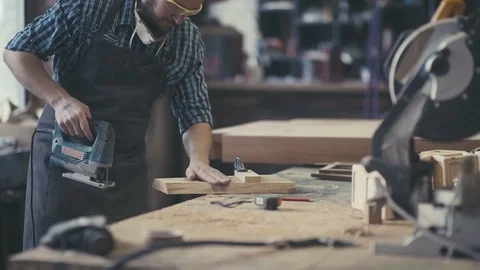 Workplace of cabinetmaker. Carpenter works with a planer in a workshop Video stock 72732299