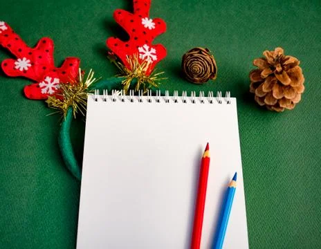 Workplace for Christmas concept. Blank notebook and colored pencils for your  Foto stock
