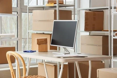 Workplace with computer in warehouse Stock Photos