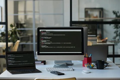 Workplace with computers with codes Stock Photos