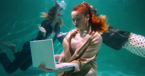 Workplace conflicts. Attractive young red haired businesswoman using laptop Stock Footage 171880478