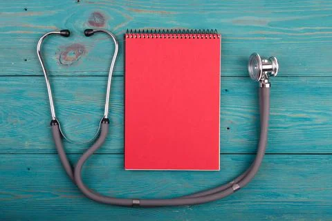 Workplace of doctor - stethoscope, notepad Foto stock