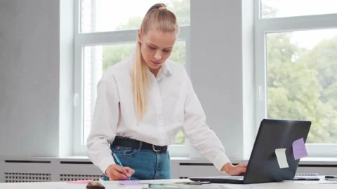 Workplace of freelance worker or a student girl at home office. Young woman Stock Footage 160761777