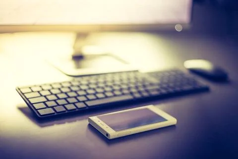 Workplace of a freelancer with computer, keyboard and smartphone Workplace... 写真素材