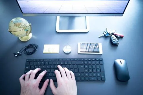 Workplace of a freelancer with computer, keyboard, credit card and compass... Stock Photos
