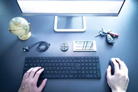 Workplace of a freelancer with computer, keyboard, credit card and compass... Stock Photos