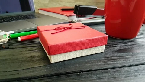 Workplace hand gift box slow motion Stock Footage 90064456