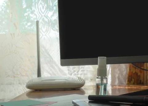 Workplace with hand sanitizer spray, computer for work form home. The concept Foto stock