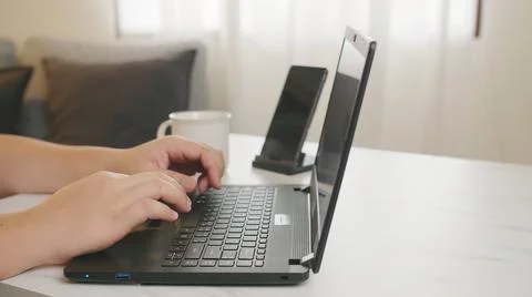 Workplace at home with programmer technology. Programmer working at home drin Stock Photos