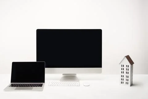 Workplace house model desktop computer Stock Photos