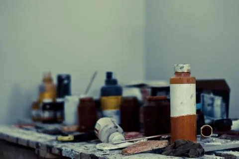 Workplace with jars of paint Stock Photos
