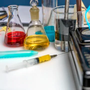 Workplace of a laboratory assistant, test tubes and laboratory equipment. Foo Stock Photos