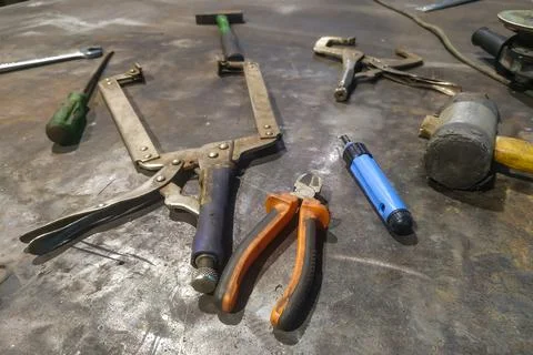 The workplace of a locksmith welder with different tools Stock Photos