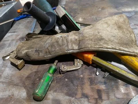 The workplace of a locksmith welder with different tools Stock Photos