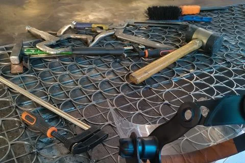 The workplace of a locksmith welder with different tools Stock Photos