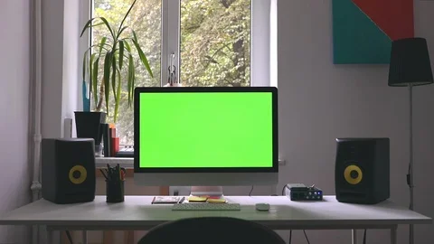 Workplace at loft room with personal computer green screen and chroma key work Stock Footage 116334174