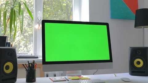 Workplace at loft room with personal computer green screen and chroma key work Stock Footage 116335182