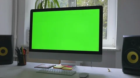 Workplace at loft room with personal computer green screen and chroma key work Stock Footage 116335354