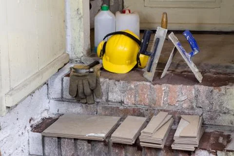 A workplace for a master from laying tiles. Tools and accessories as well as  Stock Photos