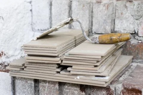 A workplace for a master from laying tiles. Tools and accessories as well as  Stock Photos