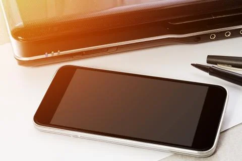 Workplace with mobile phone Stock Photos