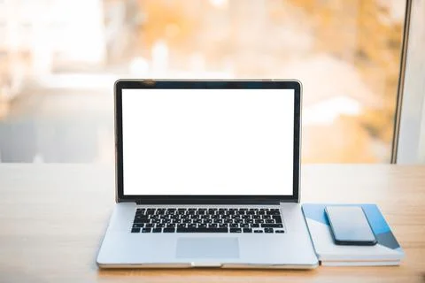 Workplace with mockup laptop on the table Stock Photos