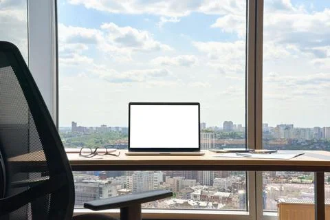 Workplace in modern office with blank empty mockup screen pc laptop computer. Stock Photos