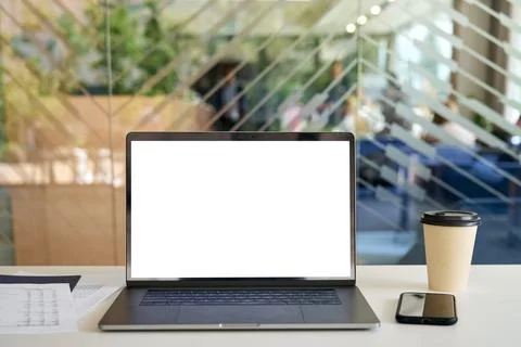Workplace in modern office with blank empty mockup screen pc laptop computer. Foto stock