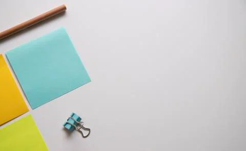 Workplace with note pad paper and office supply on the white table in modern Stock Photos