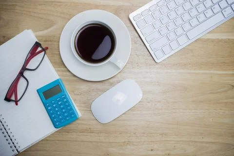 Workplace with notebook and keyboard, mouse on wooden table Stock Photos