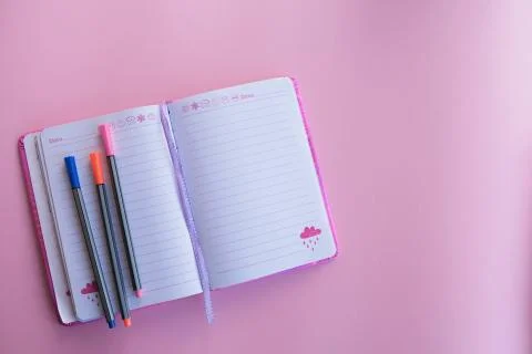 Workplace. Notebook and pens. Stock Photos