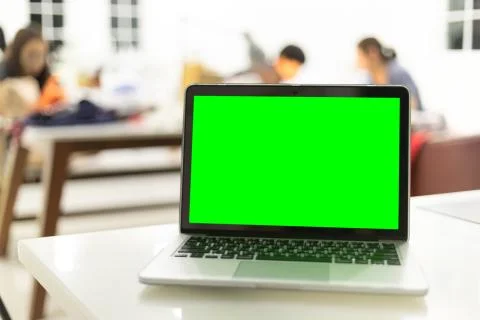 Workplace with notebook laptop Comfortable work table in office Stock Photos