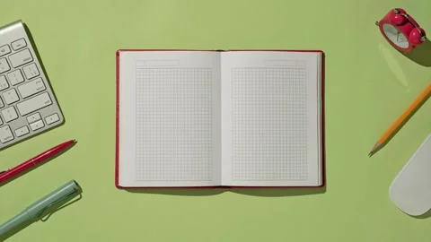 Workplace in the office or at home on the table with a notebook or diary Stock Footage 220601167