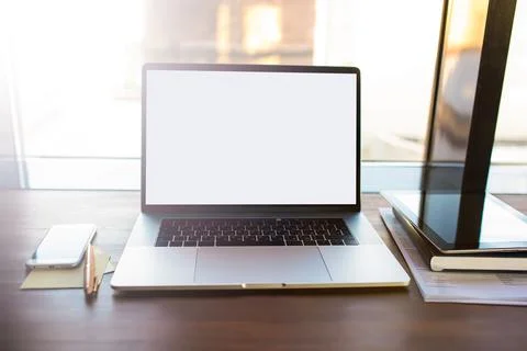 Workplace with open pc laptop computer with empty mock up copy space screen b Foto stock