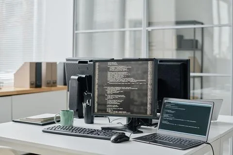 Workplace of programmer with computer monitors Foto stock