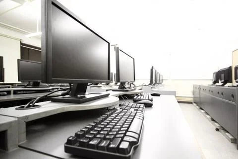 Workplace room with computers in row Stock Photos