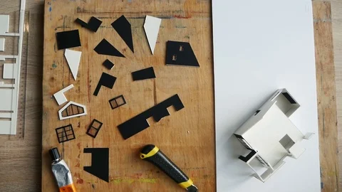 Workplace of sculptor. Creating layout of the house Stock Footage 116679682