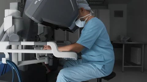 Workplace of surgeon using modern minimal invasive robotic medical system Stock Footage 244054355