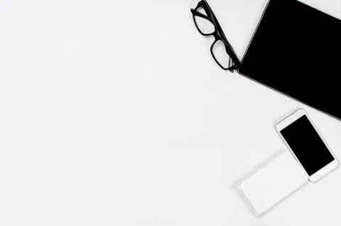 Workplace with tablet, smartphone, pen, notepad and glasses. Stock-Fotos