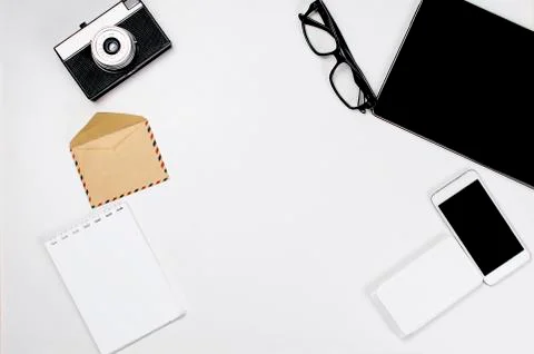 Workplace with tablet, smartphone, pen, notepad and glasses. Stock-Fotos