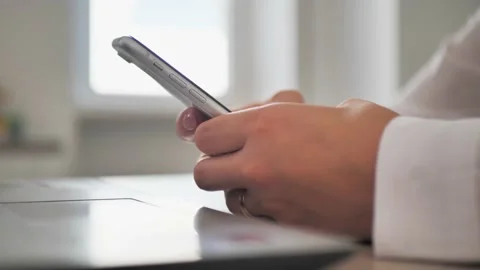 At workplace using smartphone, texting, choose and buy goods and services online Video stock 201716589