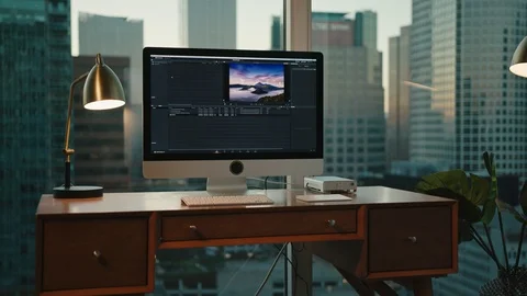 Workplace with view on Downtown LA, editing photos Stock Footage 127402230