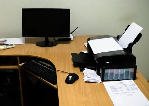 Workplace with wood table, computer, printer, monitor, mouse and keyboard Stock Photos