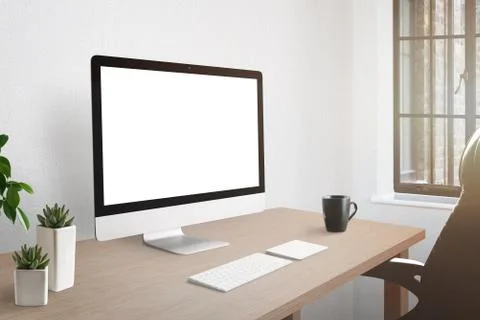 Workroom desk with computer display with isolated screen for mockup. Plants a Stock Photos