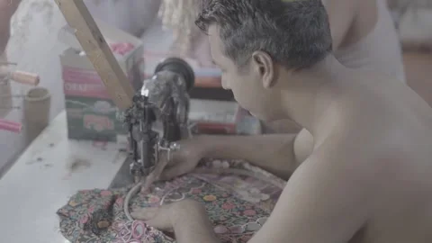 A workshop and men sewing in Mumbai, India Stock Footage 345389572
