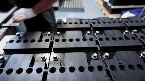 Workshop for the assembly of car batteries. Almost finished batteries. Видео 144655066