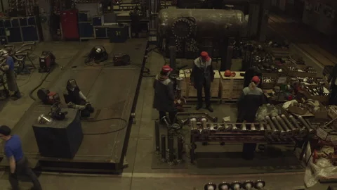 Workshop buzzes with activity as workers focus on tasks Stock Footage 304413291