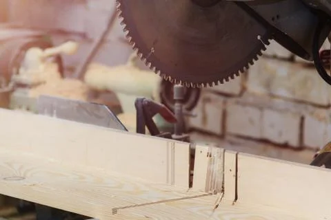 Workshop of Cabinetmaker Carpenter - Working with Wood. Electric Backsaw with Stock Photos