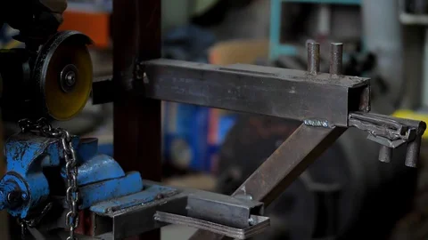 In the workshop. Close-up.The man saws the chain into parts using a circular saw Stock Footage 129503355