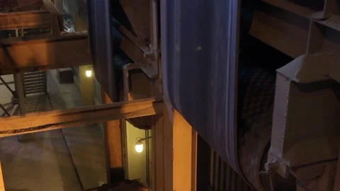 In the workshop, the conveyor belt moves vertically, continuously. Stock Footage 122214143